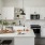 a kitchen with white cabinets
