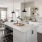 a kitchen with white cabinets