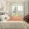 a bedroom with a bed and a chair