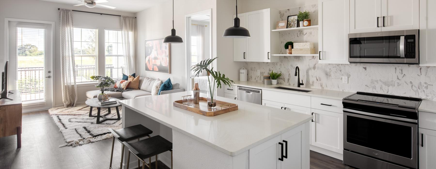 a kitchen with white cabinets