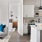 a kitchen with white cabinets